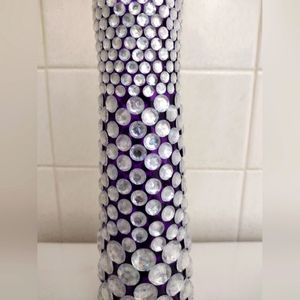 Shiny silver and purple vase.